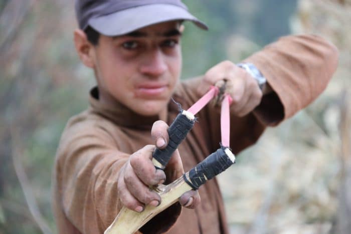 boy with slingshot