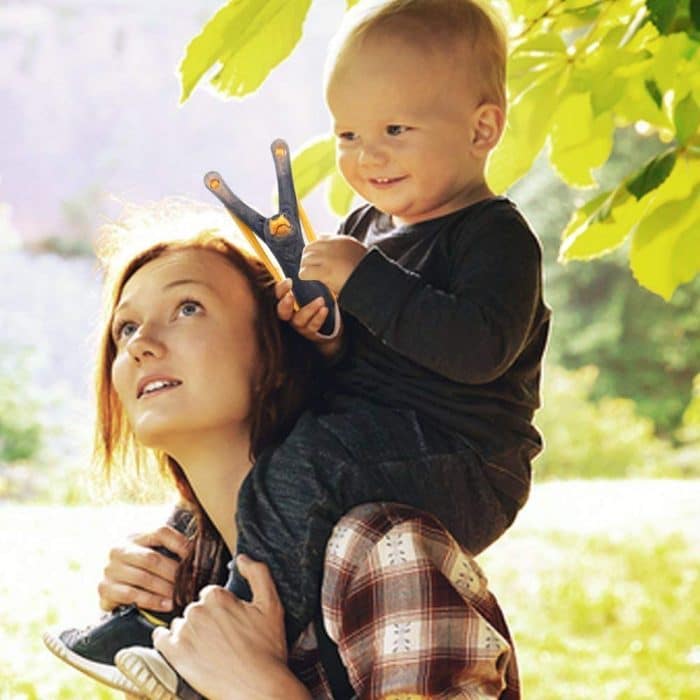 kid holding a slingshot