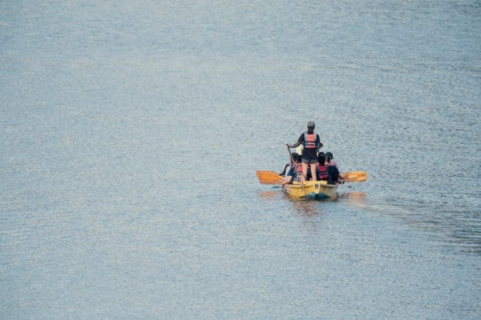 people in yellow boat