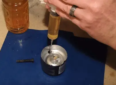 Pour some oil into the wick and also on the fill hole