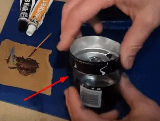 Push Top Can at the bottom with the adhesive