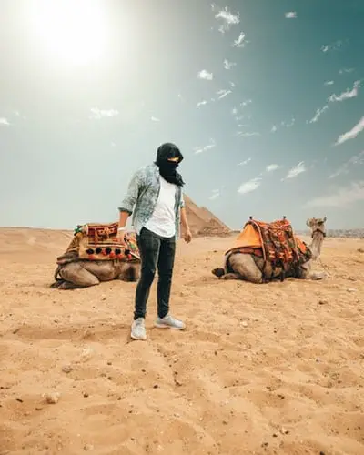 man wearing shemagh in desert