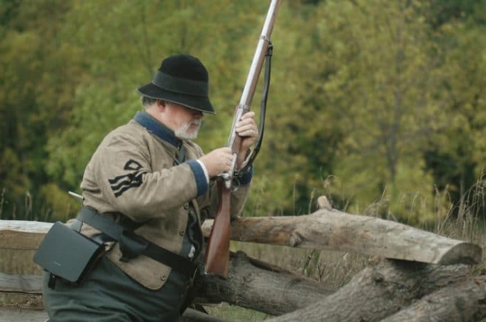 Man using air rifle