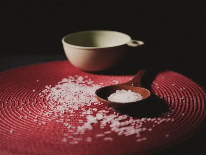 Rice grains on red mat