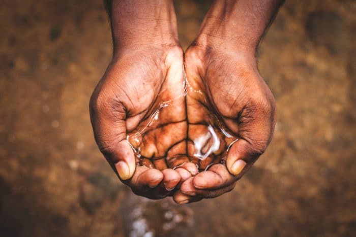 Man holding water in hands